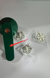 USB Rechargeable Lint Remover with replacement blades on a flat surface.